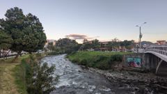 river and bridge in urban park