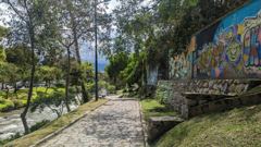 cobblestone path beside mural wall