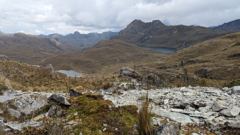 rocky highland valley with cloudy sky