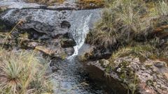 small waterfall or stream cascade