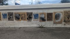 wall with framed mural panels