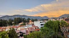 city and mountains at sunset