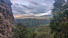 mountain valley from rock wall