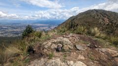 rocky hilltop and city valley view
