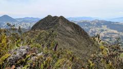 green mountain peak above city
