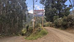 dirt road with sign