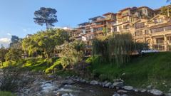 river below hillside buildings